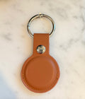 Brown PU leather AirTag keychain with customized engraved text and metal ring