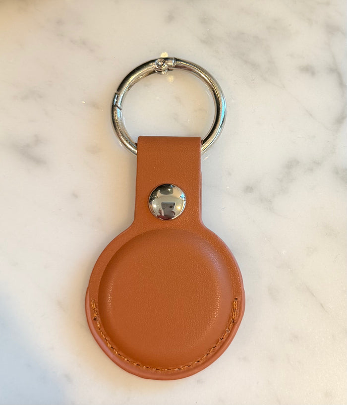Brown PU leather AirTag keychain with customized engraved text and metal ring