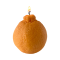 Realistic orange fruit shaped candle with green leaf detail on neutral background