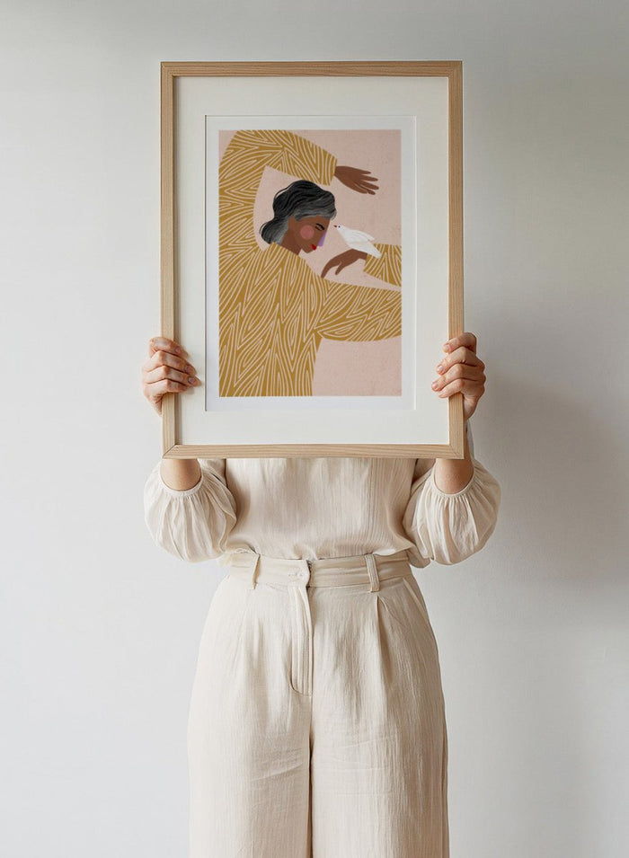 The Woman With a Bird by Bea Müller is an officially licensed art print featuring a modern illustrated woman and a white bird. Available framed or unframed.