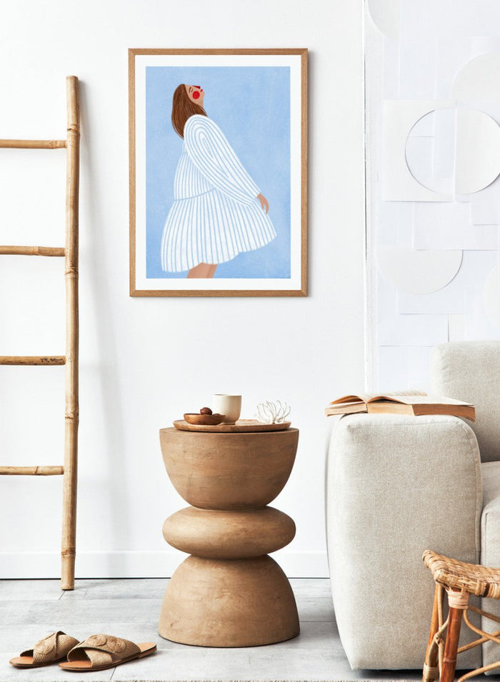 The Woman With the Blue Stripes by Bea Müller is an officially licensed art print featuring soft blue tones and a flowing modern portrait. Framed or unframed options available.