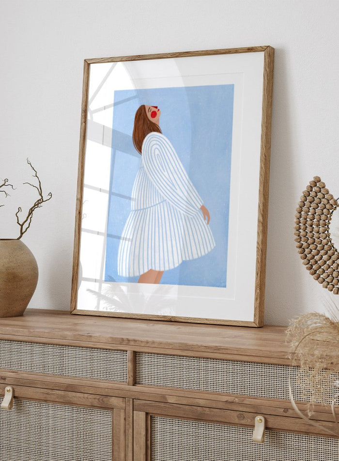 The Woman With the Blue Stripes by Bea Müller is an officially licensed art print featuring soft blue tones and a flowing modern portrait. Framed or unframed options available.