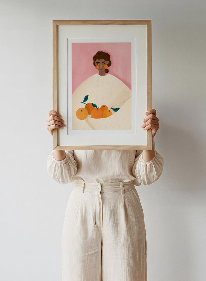 The Woman With the Oranges by Bea Müller is an officially licensed art print featuring warm citrus tones and a modern illustrated portrait. Available framed or unframed.