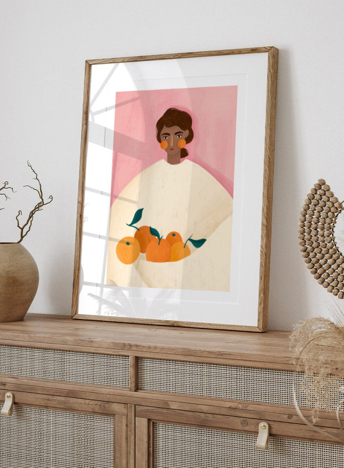 The Woman With the Oranges by Bea Müller is an officially licensed art print featuring warm citrus tones and a modern illustrated portrait. Available framed or unframed.