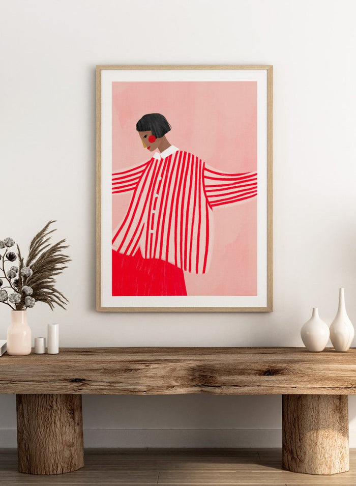The Woman With the Red Stripes by Bea Müller is an officially licensed art print featuring bold red patterns and a modern illustrated woman. Available framed or unframed.