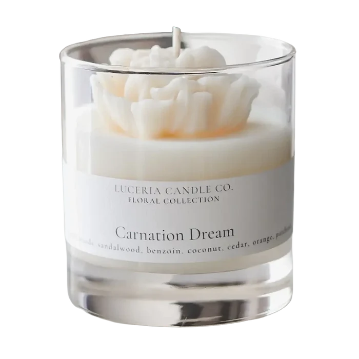 Luceria Carnation Dream candle in a glass vessel with soft floral packaging