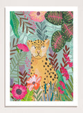 Illustration of a cheetah surrounded by colorful flowers and leaves on a light blue background. Happy Leopard Tropical Flowers by Caroline Bonne Müller is a fine art print and wall poster featuring a leopard with tropical flowers in a modern aesthetic style.