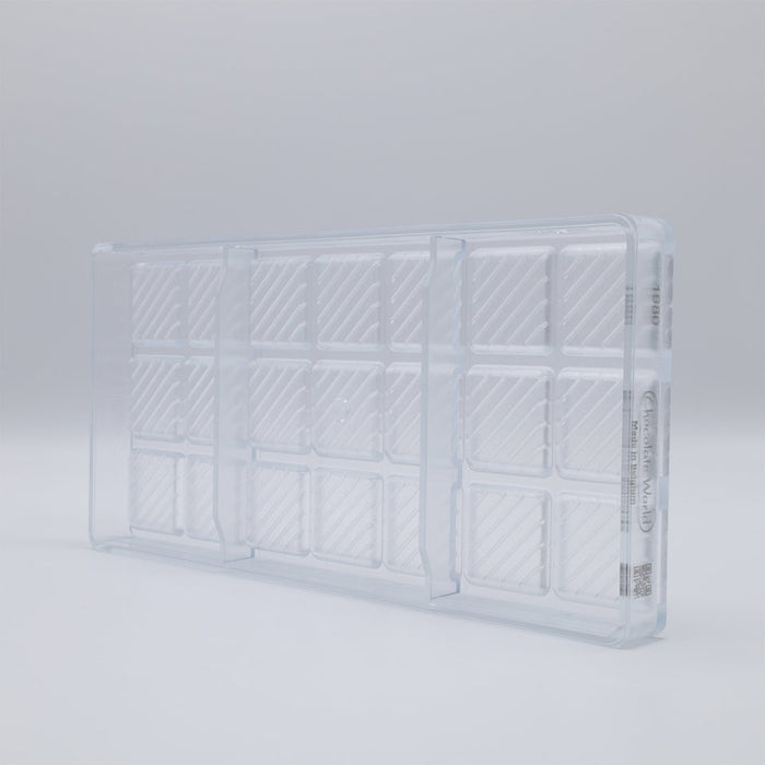 Chocolate World Caraque with Lines Polycarbonate Chocolate Mold – ~1.97 x 1.18 x 0.20 in, 18 Cavities