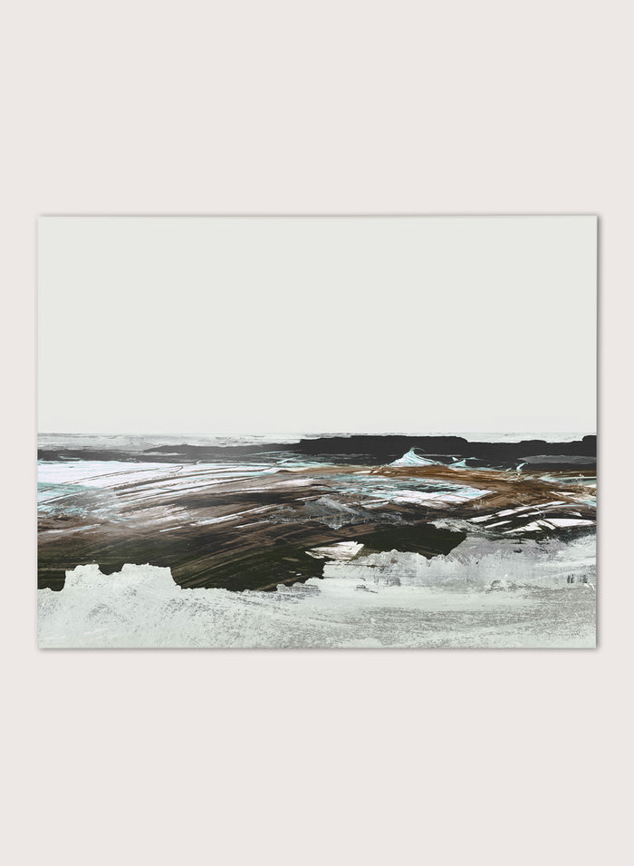 A framed abstract landscape art print featuring textured brushstrokes of brown, white, gray, and black. Shop Constantine Bay by Dan Hobday, a contemporary coastal wall art print with abstract shoreline forms, pale blue accents, dark brown tones, and textured brushwork.