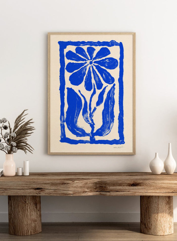 Blue floral design on a beige background. Blue Bloom by Eden Kalif is a modern floral art print featuring bold blue flower forms and graphic composition in a contemporary wall poster design.