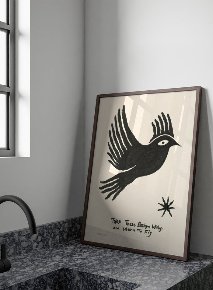 Black bird illustration with 'Take These Broken Wings and Learn to Fly' text on a beige background. Fly Away by Eden Kalif is a modern bird art print with expressive line work and handwritten text, a contemporary minimalist wall poster about growth and freedom.