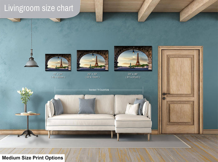The image is a livingroom size chart with three framed pictures of the Eiffel Tower displayed on the wall. The chart provides the dimensions of each picture in inches, ranging from 10 to 24 inches.