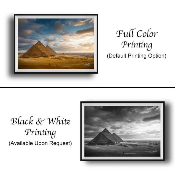 The image is a collage of two framed pictures. The top picture is a full-color print of the pyramids of Giza, Egypt, with a black and white filter applied. The bottom picture is a black and white print of the same pyramids, without any color. Both pictures are framed and displayed side by side, showcasing the contrast between the full-color and black-and-white versions of the same landmark.