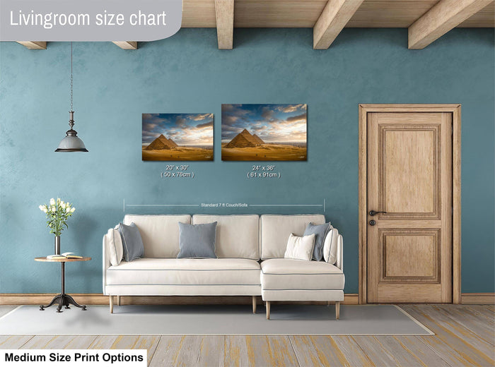 a living room with a white sofa, a wooden door, and a painting of the pyramids of Giza hanging on the wall.