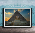 a large, ancient Egyptian pyramid with a sphinx statue in the foreground, set against a colorful sunset sky.