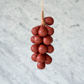 Wine-colored handcrafted olive oil soap shaped like a cluster of grapes