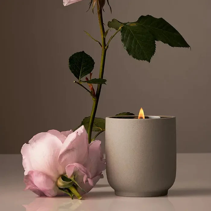 Homecourt Steeped Rose signature candle in white vessel with a custom logo label