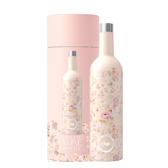 A flowery insulated wine bottle with a pink and white floral print stands next to its matching pink cylindrical packaging box on a white background.
