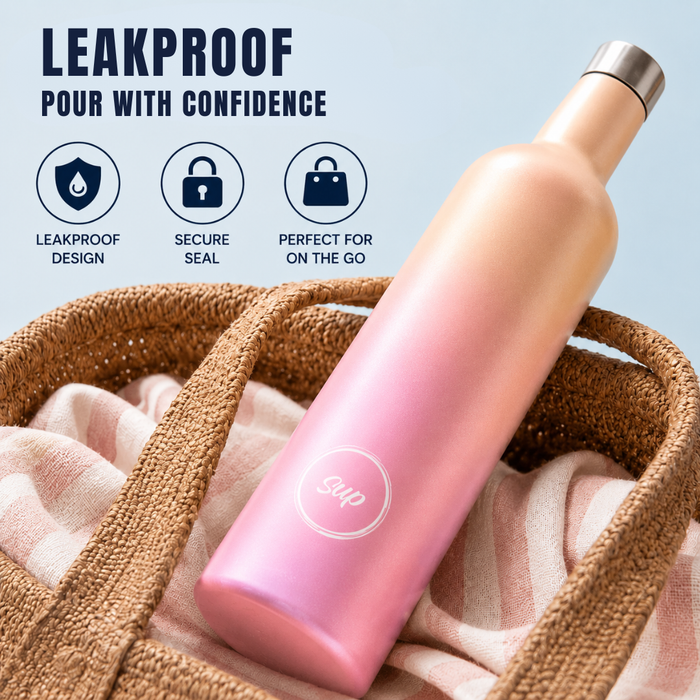 A pink and rose gold insulated wine bottle with a metallic silver cap, resting on a woven straw bag with a pink striped cloth. The image includes marketing text 'LEAKPROOF POUR WITH CONFIDENCE' and three feature icons on a light blue background.