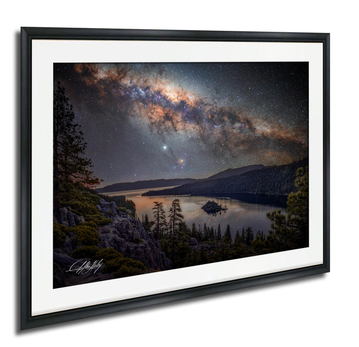a serene night scene with a lake surrounded by mountains and trees, with a starry sky above.