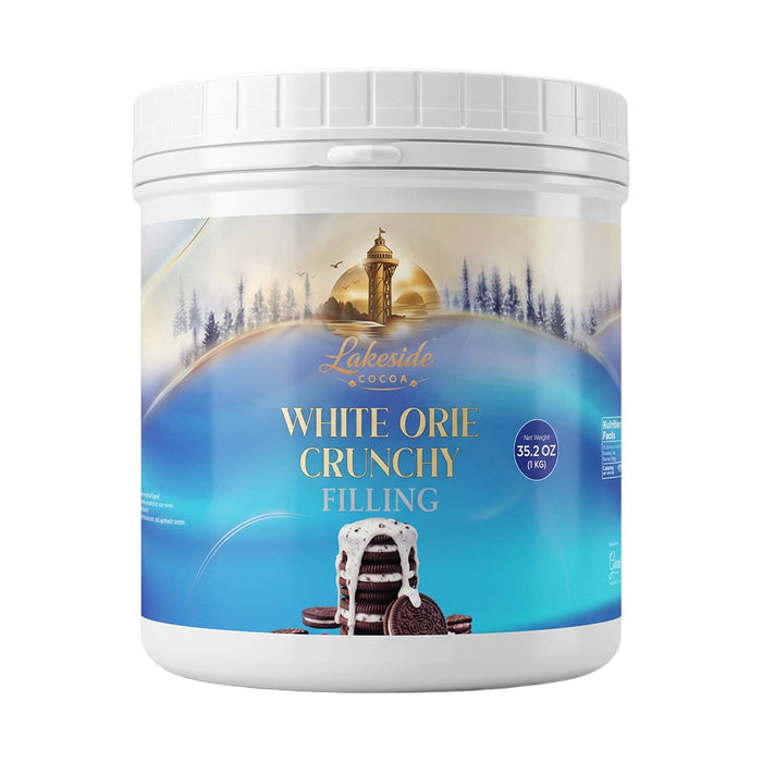 Lakeside Cocoa White Orie Crunchy Filling 1 kg product packaging,
Lakeside Cocoa White Orie Crunchy Filling used in cakes, pastries, chocolates, and desserts,
Close-up of Lakeside Cocoa white chocolate cream with crunchy biscuit crumbs.
