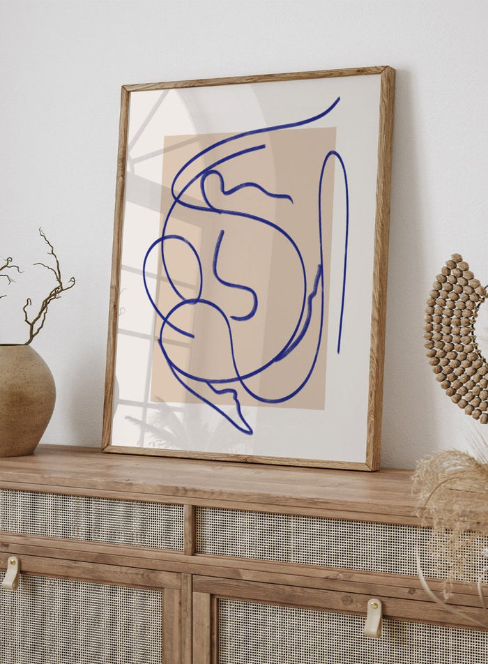 Abstract blue line art on a beige background. Abstract Fluid Line by Little Dean minimalist line art print featuring abstract female figure drawing, modern continuous line illustration wall art poster.