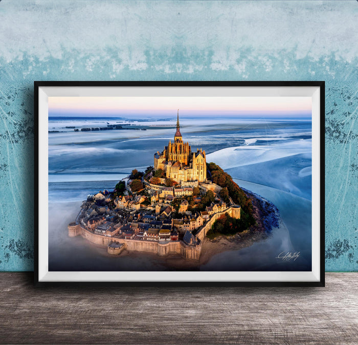 a picturesque island with a castle-like structure on top, surrounded by a body of water.