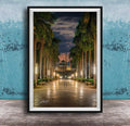 A framed photograph depicting a serene nighttime scene of a palm-lined walkway leading towards a building with a dome, illuminated by warm lighting.