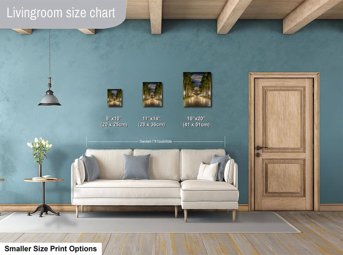 a living room with a white sofa, a wooden door, and a hanging light fixture. There are three framed pictures of different sizes displayed on the wall, and a smaller print option is available for smaller size prints.