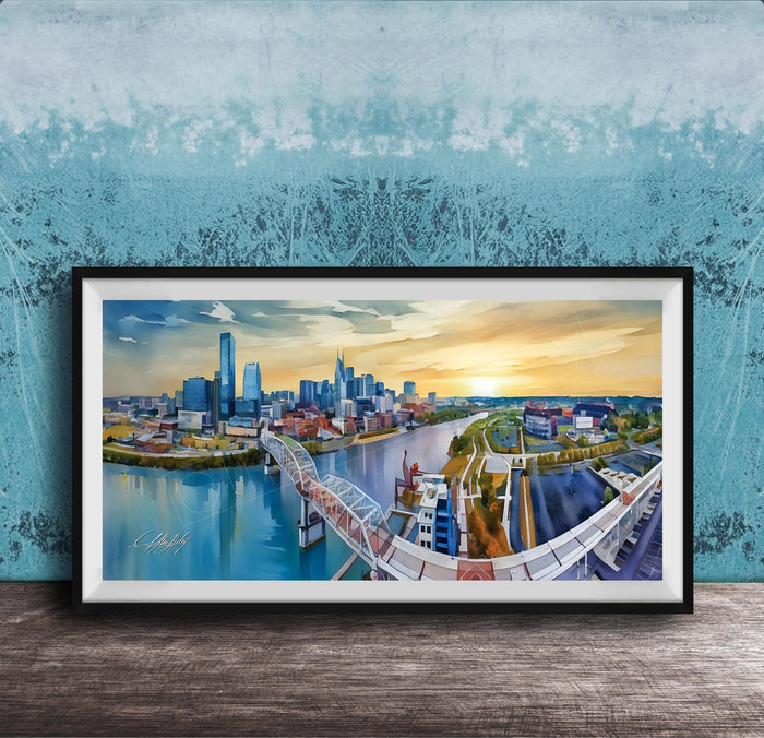 A framed painting depicting a cityscape with a bridge, buildings, and a river, set against a blue sky with a sunset.