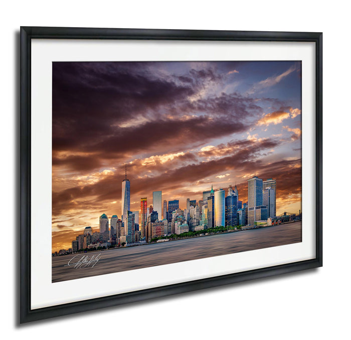 a city skyline at sunset, with the silhouettes of tall buildings against a dramatic sky filled with clouds and vibrant colors.