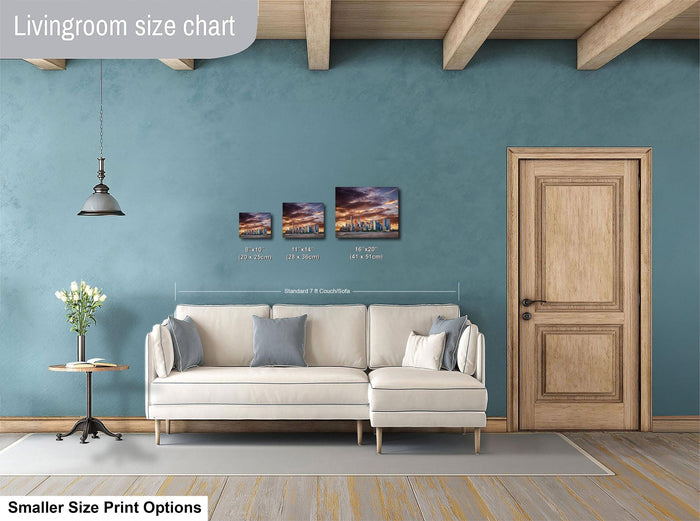 a living room with a white sofa, a wooden door, and a hanging light fixture. There are three framed artworks displayed on the wall, each with different sizes and dimensions. The living room appears to be well-decorated and spacious.