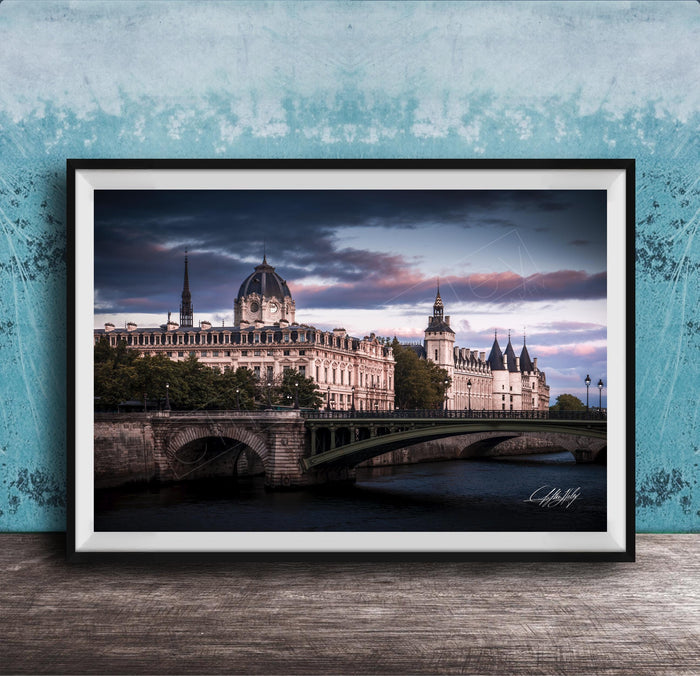 a picturesque scene of a historic building with a dome and a bridge spanning a river, set against a dramatic sky with clouds.