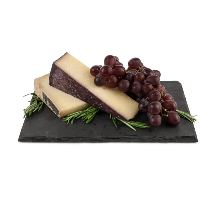 Slate cheeseboard with natural rough edges and personalized engraved text on surface