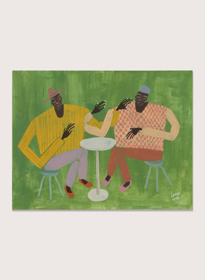 Framed artwork of two people sitting at a table on a green background. In Good Company by Studio IMO (Ibi Meier-Oruitemeka) is a modern figurative art print featuring two figures at a table in a bold contemporary wall poster design.