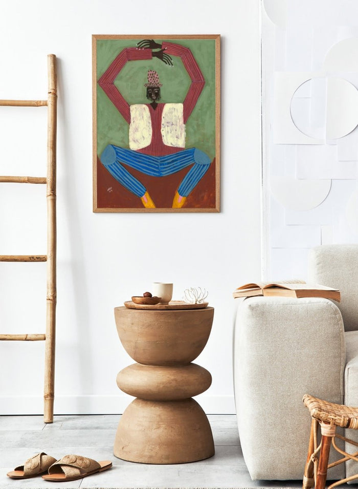 Artistic depiction of a figure with red shirt, blue pants, and yellow shoes on a green background. Open Up by Studio IMO (Ibi Meier-Oruitemeka) is a modern figurative art print featuring a seated figure with bold color and contemporary portrait poster design.