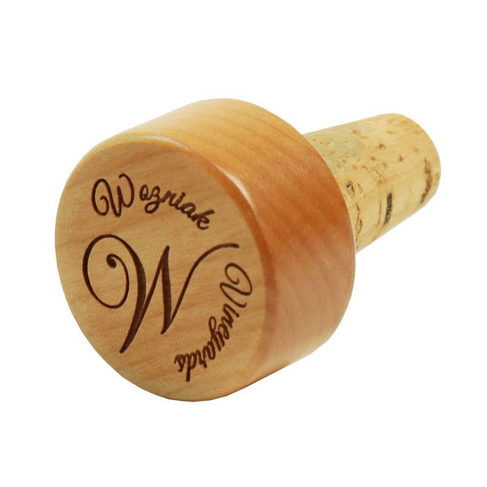 Wooden wine bottle stopper with custom engraved text on the cylindrical wood top